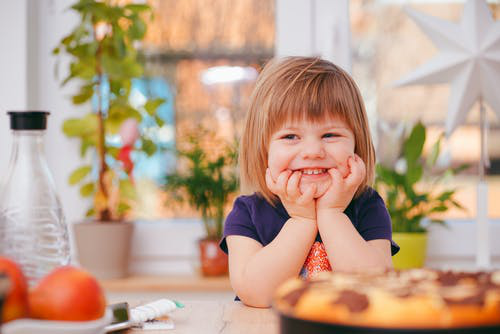 A smiling toddler, ready for toilet training.