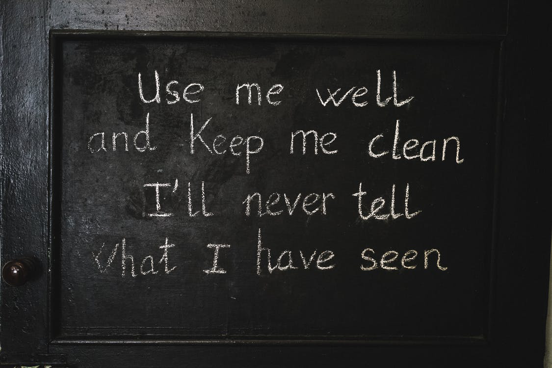 A black chalkboard with a message on it.